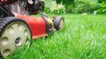 red mower on grass at Bellevue